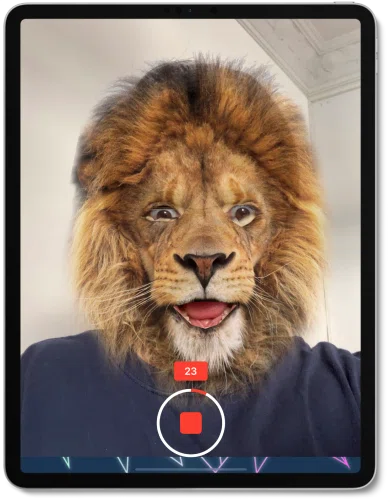 an iPad with an image of a person with the face of a lion